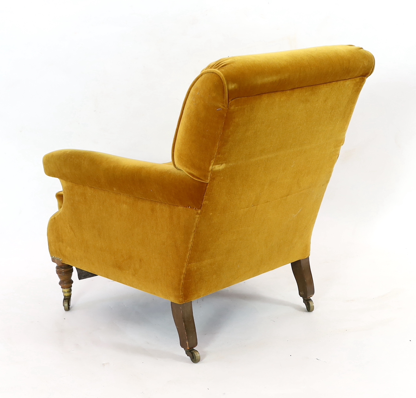 A late Victorian Howard & Sons upholstered armchair